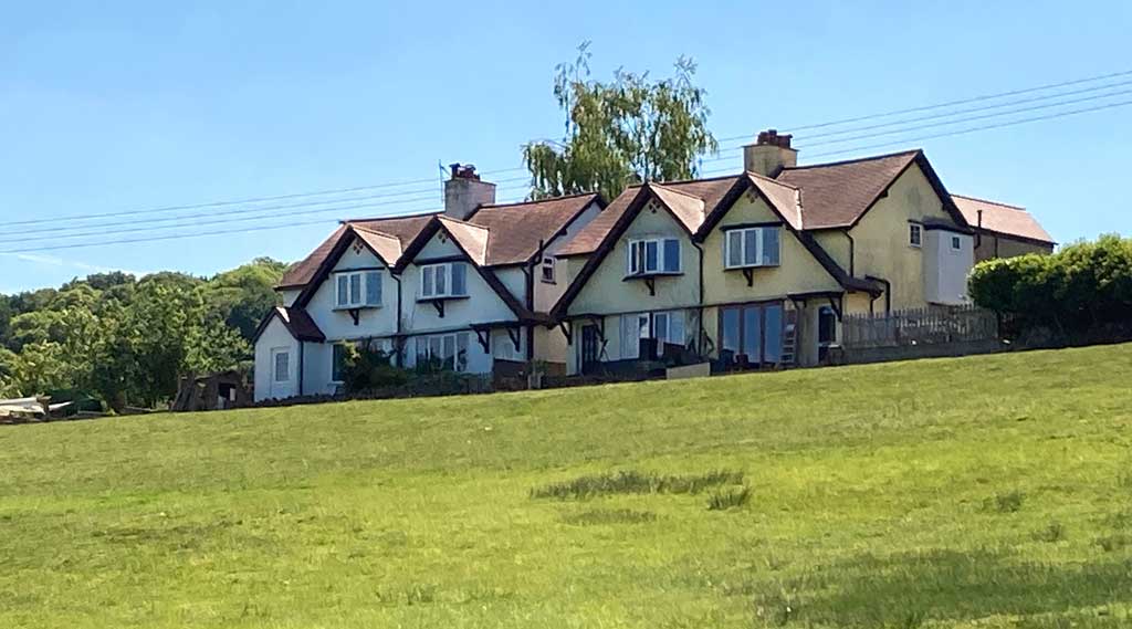 A photo of the four houses of Knox Road, Brockhollands.