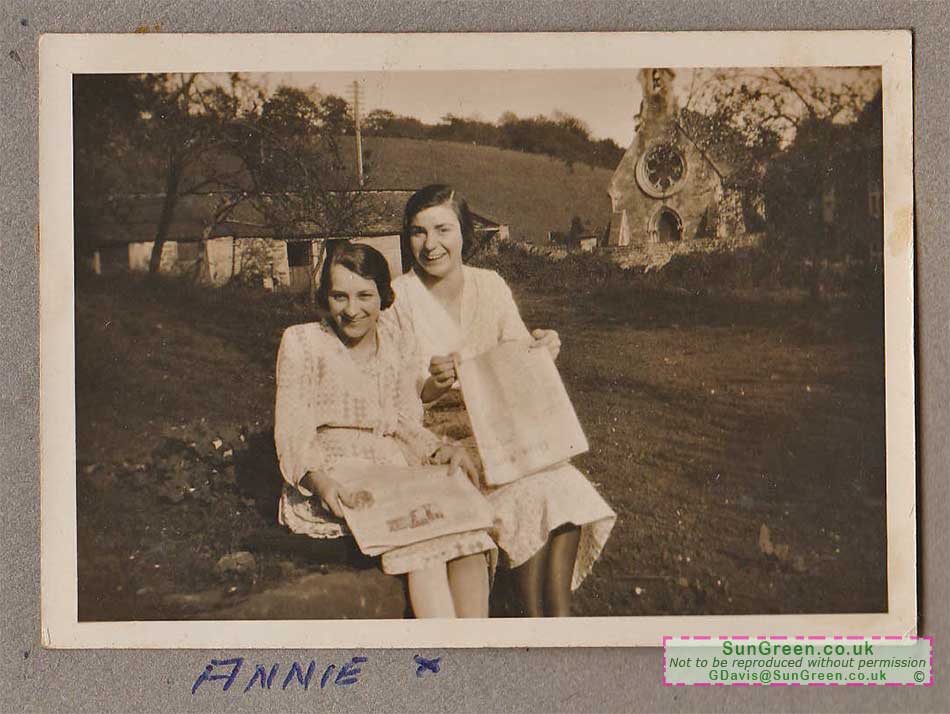 An old photo of two ladies in a garden opposite the Mortuary Chapel, Clearwell.
