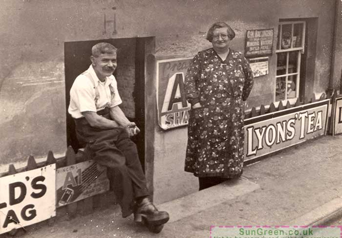 A photo of the Hudsons outside the shop they ran in Redbrook