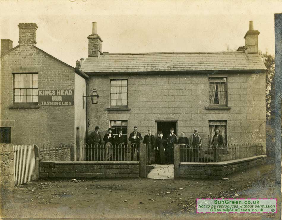 An old photo of a group of men standing outside the Kings Head public house, Bream