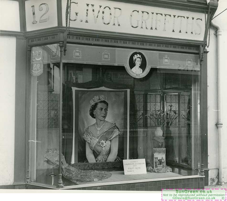 An old photo of 12 Hill Street, Lydney showing the coronation celebration shop front