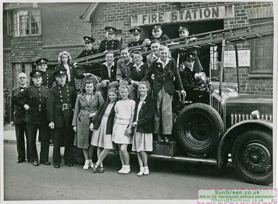 An old photo of a fire engine and people outside Lydney Fire Station